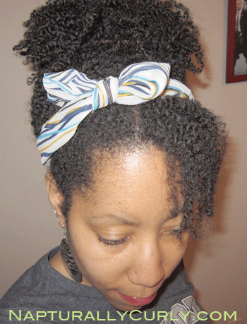 puff with a headband tied into a bow
